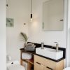 KOHLER Verdera medicine cabinet, KOHLER Purist faucet, Ikea sink, Separett composting waterless toilet, Ann Sacks Savoy Mosaic tile, Boll& Branch organic towels, Plumen 003 Dimmable LED Pendant Set and ply/Richlite vanity by Mike Gagne.